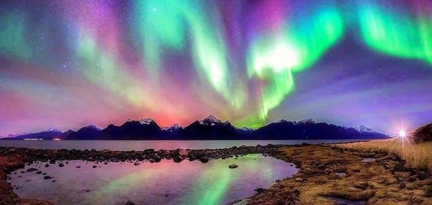 ظاهرة الشفق القطبي لوحة فنية طبيعية ترقص في سماء الليل